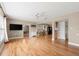 Bright living room with hardwood flooring, opening into the dining and kitchen area at 2361 Rose St, Sarasota, FL 34239