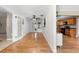 Bright open-concept layout with hardwood flooring connecting the living area to the kitchen, great for entertaining at 2361 Rose St, Sarasota, FL 34239