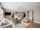 Bright living room with hardwood flooring, opening into the dining and kitchen area at 2361 Rose St, Sarasota, FL 34239