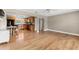 Bright living room with hardwood flooring, opening into the dining and kitchen area at 2361 Rose St, Sarasota, FL 34239