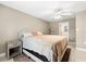 Comfortable main bedroom offering ample space, neutral walls, a ceiling fan, and soft lighting at 2361 Rose St, Sarasota, FL 34239