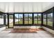 Sunroom featuring tile floors and multiple windows at 2361 Rose St, Sarasota, FL 34239