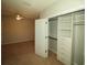 Bedroom featuring neutral walls, carpeted flooring, and a closet with built-in shelving at 2384 Midnight Pearl Dr, Sarasota, FL 34240
