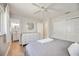 Well-lit main bedroom with closet, ceiling fan, and entry to the ensuite bathroom at 2409 Wells Ave, Sarasota, FL 34232