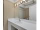 Bathroom featuring neutral cabinets and counters with a sink and a mirror at 3140 Village Green Dr # 1119, Sarasota, FL 34239