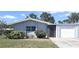 Charming single-story home featuring a well-maintained lawn and attached garage at 3140 Village Green Dr # 1119, Sarasota, FL 34239