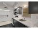 Elegant kitchen featuring granite countertops, stainless steel appliances, and modern cabinetry at 3140 Village Green Dr # 1119, Sarasota, FL 34239