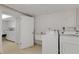 A dedicated laundry area provides convenience with washer, dryer, sink, and counter space at 3140 Village Green Dr # 1119, Sarasota, FL 34239