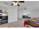 Open floor plan featuring a cozy seating area, dining space, and modern gray kitchen at 3140 Village Green Dr # 1119, Sarasota, FL 34239