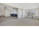 Living room featuring an open floor plan, multiple windows, and bright light at 3140 Village Green Dr # 1119, Sarasota, FL 34239