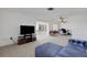 Open living area offering ample space, neutral carpet, and lots of natural light at 3140 Village Green Dr # 1119, Sarasota, FL 34239