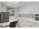 Bright pantry offers lots of cabinet space and a mini-fridge to keep your food nice and cool at 3140 Village Green Dr # 1119, Sarasota, FL 34239