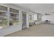 Bright sun room featuring multiple windows and neutral-toned walls and carpeting at 3140 Village Green Dr # 1119, Sarasota, FL 34239