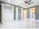 Spacious bedroom with tile flooring and modern ceiling fan at 3367 Tucson Rd, North Port, FL 34286