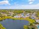 Aerial view of a home with pond access in a serene neighborhood with lush landscaping at 3611 22Nd W Ave, Bradenton, FL 34205