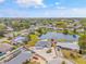 Aerial view of neighborhood showcasing a beautiful pond and landscaped yards at 3611 22Nd W Ave, Bradenton, FL 34205