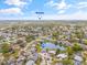 Stunning aerial view showcasing a property near beaches, surrounded by lush trees and neighborhood homes at 3611 22Nd W Ave, Bradenton, FL 34205