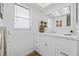 Bright bathroom with white vanity, quartz countertop, and ample storage space at 3611 22Nd W Ave, Bradenton, FL 34205