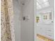 Bathroom with white tiled walk-in shower, modern fixtures, and bright lighting at 3611 22Nd W Ave, Bradenton, FL 34205