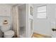 Bathroom featuring a walk-in shower, white cabinetry, and a neutral color scheme at 3611 22Nd W Ave, Bradenton, FL 34205