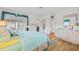 Spacious bedroom with a walk-out patio featuring wood floors and ample closet space at 3611 22Nd W Ave, Bradenton, FL 34205