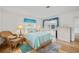 Cozy bedroom featuring wood floors, natural lighting, and comfortable furnishings at 3611 22Nd W Ave, Bradenton, FL 34205