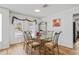 Bright dining room featuring a glass-top table and ornate metal chairs, perfect for Gathering meals at 3611 22Nd W Ave, Bradenton, FL 34205
