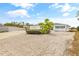 Inviting single-story home with lush landscaping, a circular driveway, and a two car garage at 3611 22Nd W Ave, Bradenton, FL 34205