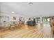 Bright living room with hardwood floors, a dining area, a comfortable couch, and sliding glass doors at 3611 22Nd W Ave, Bradenton, FL 34205