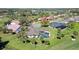 Aerial view of a home with a pool, screened-in porch, and a large backyard at 3704 Prairie Dunes Dr, Sarasota, FL 34238