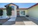 Charming front entrance with decorative glass door, mature tree, and well-maintained walkway at 3704 Prairie Dunes Dr, Sarasota, FL 34238
