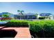 Waterfront home featuring a dock and screened lanai for outdoor entertaining and enjoying peaceful water views at 3707 5Th Ne Ave, Bradenton, FL 34208