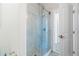 Modern bathroom with a glass-enclosed shower and gray stone flooring at 3707 5Th Ne Ave, Bradenton, FL 34208