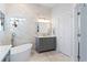 Bright bathroom featuring a freestanding tub, marble walls, and stone flooring at 3707 5Th Ne Ave, Bradenton, FL 34208
