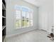 Light-filled bedroom featuring plantation shutters and wood floors at 3707 5Th Ne Ave, Bradenton, FL 34208