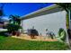 Home exterior with landscaping and AC unit, highlighting the practical and aesthetic aspects of the property at 3707 5Th Ne Ave, Bradenton, FL 34208