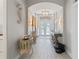 Spacious foyer with arched ceilings, decor, wall lighting, and double doors leading into the home at 3707 5Th Ne Ave, Bradenton, FL 34208