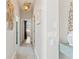 Bright hallway with neutral walls and modern light fixtures at 3707 5Th Ne Ave, Bradenton, FL 34208