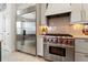 Close up of the kitchen featuring Wolf oven, stainless refrigerator and lots of storage at 3707 5Th Ne Ave, Bradenton, FL 34208