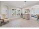 Bright living room with ample natural light, wood-look tile flooring, and neutral color palette at 3707 5Th Ne Ave, Bradenton, FL 34208