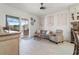 Open-concept living room featuring sliding glass doors to the outdoor space and stylish decor at 3707 5Th Ne Ave, Bradenton, FL 34208