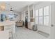 Bright open living area with a wine fridge and sliding glass doors to the patio at 3707 5Th Ne Ave, Bradenton, FL 34208
