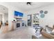 Living room boasts a large sliding glass door to the outside and TV on the wall at 3707 5Th Ne Ave, Bradenton, FL 34208