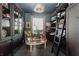 Elegant office with custom built-ins and cozy leather seating at 3707 5Th Ne Ave, Bradenton, FL 34208