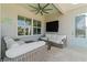 Charming outdoor patio features wicker furniture and a comfortable seating area at 3707 5Th Ne Ave, Bradenton, FL 34208