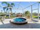 Outdoor patio features a luxurious hot tub and lovely canal views at 3707 5Th Ne Ave, Bradenton, FL 34208