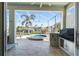 Outdoor patio area features a luxurious hot tub, grill, and canal views at 3707 5Th Ne Ave, Bradenton, FL 34208