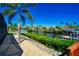 Scenic waterfront view with lush greenery and a tranquil canal reflecting homes and boats at 3707 5Th Ne Ave, Bradenton, FL 34208