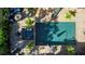 Aerial view of a private pool, spa, patio, and lush landscaping at 402 Walls Way, Osprey, FL 34229