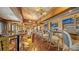Inviting bar area with ample seating, wood accents, and a fully stocked bar at 402 Walls Way, Osprey, FL 34229